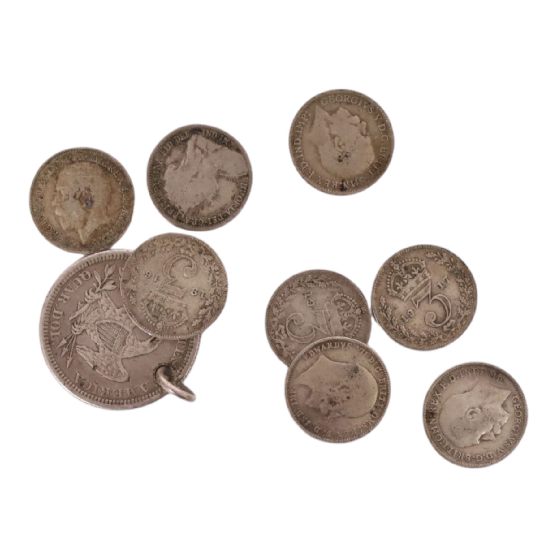 Approximately 10 grams of Great British pre-1920 and approximately 140 grams of Great British pre-1947 silver coins, together with a United States of America 1861 silver quarter dollar (drilled) and some further coins