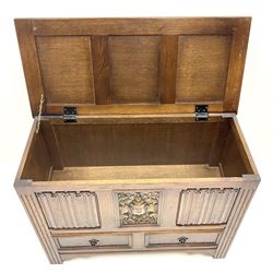 Late 20th century oak mule chest, single hinged lid above two drawers, carved panel front