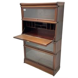 Globe Wernicke - early 20th century mahogany four-tier stacking library bookcase, three glazed sections enclosed by hinged and sliding doors, fall front section with fitted interior, with transfer label 
