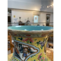 19th century Chinese famille rose yellow ground porcelain vase, of baluster form with twin applied mask ring handles, the body decorated with two shaped reserves mounted with dragon heads, depicting warriors at battle and at court, the neck with two smaller conforming figural reserves, upon a yellow ground decorated with exotic birds amidst scrolling blossom, H45.cm