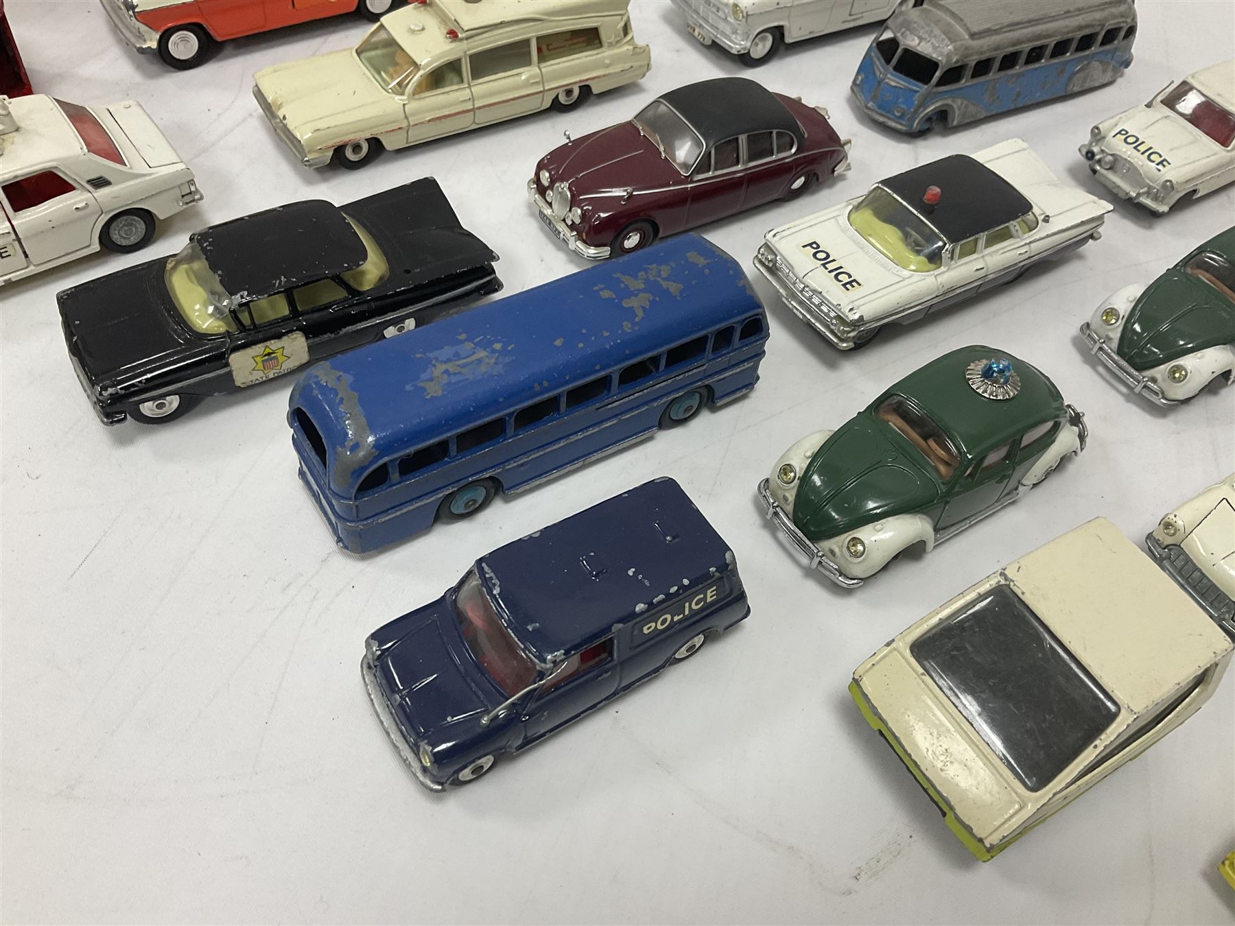Corgi/Dinky - twenty-four unboxed and playworn die-cast models, predominantly emergency vehicles and buses; including Autocar Isobloc, Superior Criterion Ambulance, Ford Transit Police Vans, Chevrolet Impalas, Minissima, Ausin Mini Police van etc (24)
