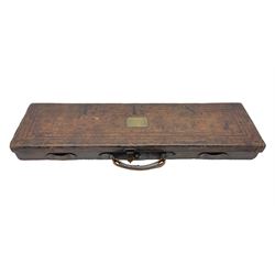 Leather shotgun case, the red baize lined interior with the trade labels of Westley Richards & Co., London, a brass plaque inscribed 'T Nevin, Mirfield, Yorkshire' to cover, with key, case to fit barrel 76cm (30 inches)  
