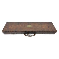 Leather shotgun case, the red baize lined interior with the trade labels of Westley Richards & Co., London, a brass plaque inscribed 'T Nevin, Mirfield, Yorkshire' to cover, with key, case to fit barrel 76cm (30 inches)  
