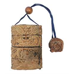 Japanese Meiji wooden four case inro, carved with dragons, with dragon netsuke and ojime bead, H8cm  