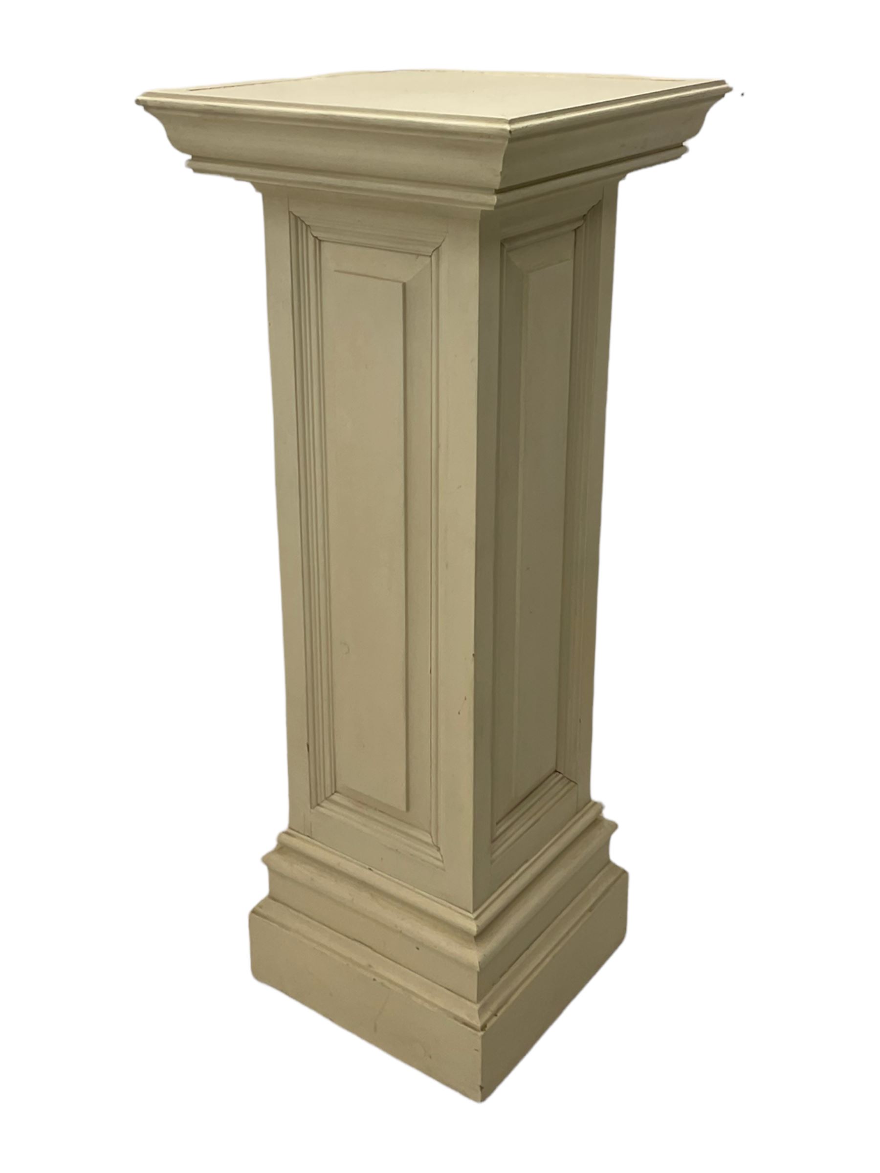 White painted pine pedestal plinth, the square moulded top over panelled rectangular body, stepped and moulded plinth base