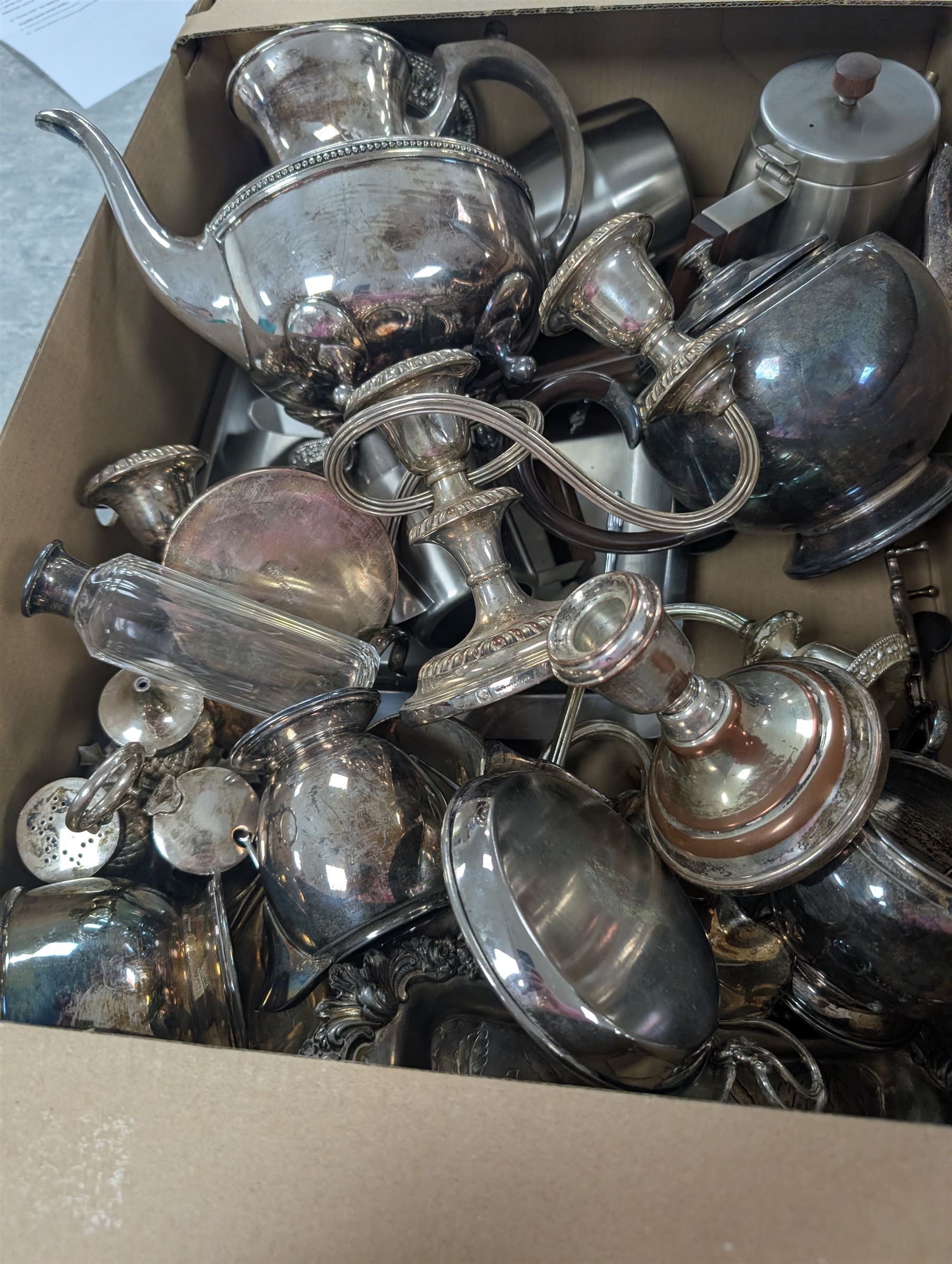 Collection of silver plate and brassware, including canteen of cutlery, horse brasses, candlesticks, teapots etc