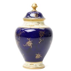 Coalport pot pourri jar and cover, circa 1920, the dark blue ground painted with landscape panels of Helvelly by E.O. (Ted) Ball, printed and painted marks to base, H17cm