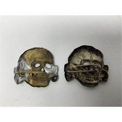 Five German 'SS' visor cap metal badges comprising one eagle and four skull and cross-bones (5)