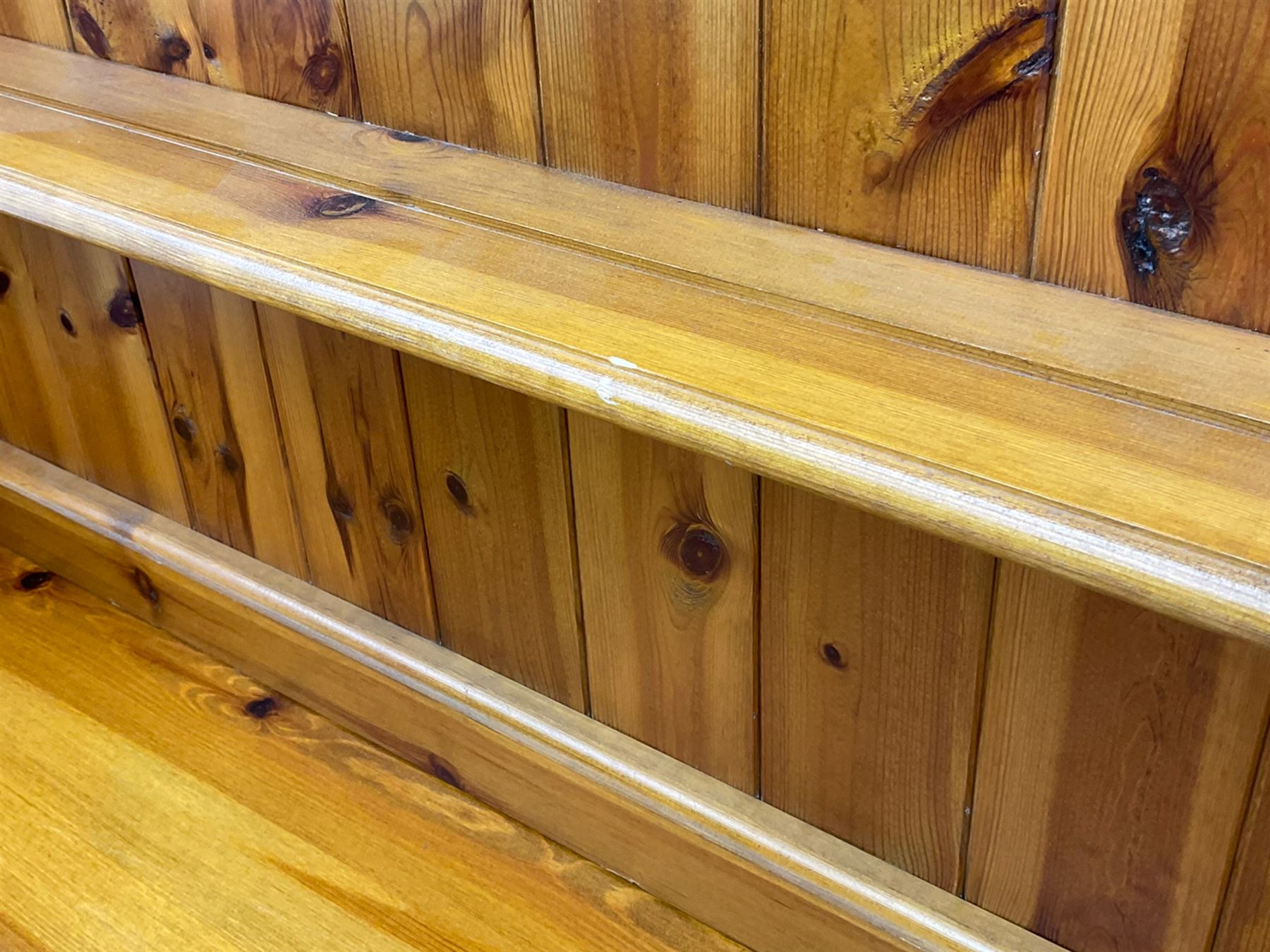 Pine farmhouse dresser with three drawers and three cupboards, and two tier plate rack