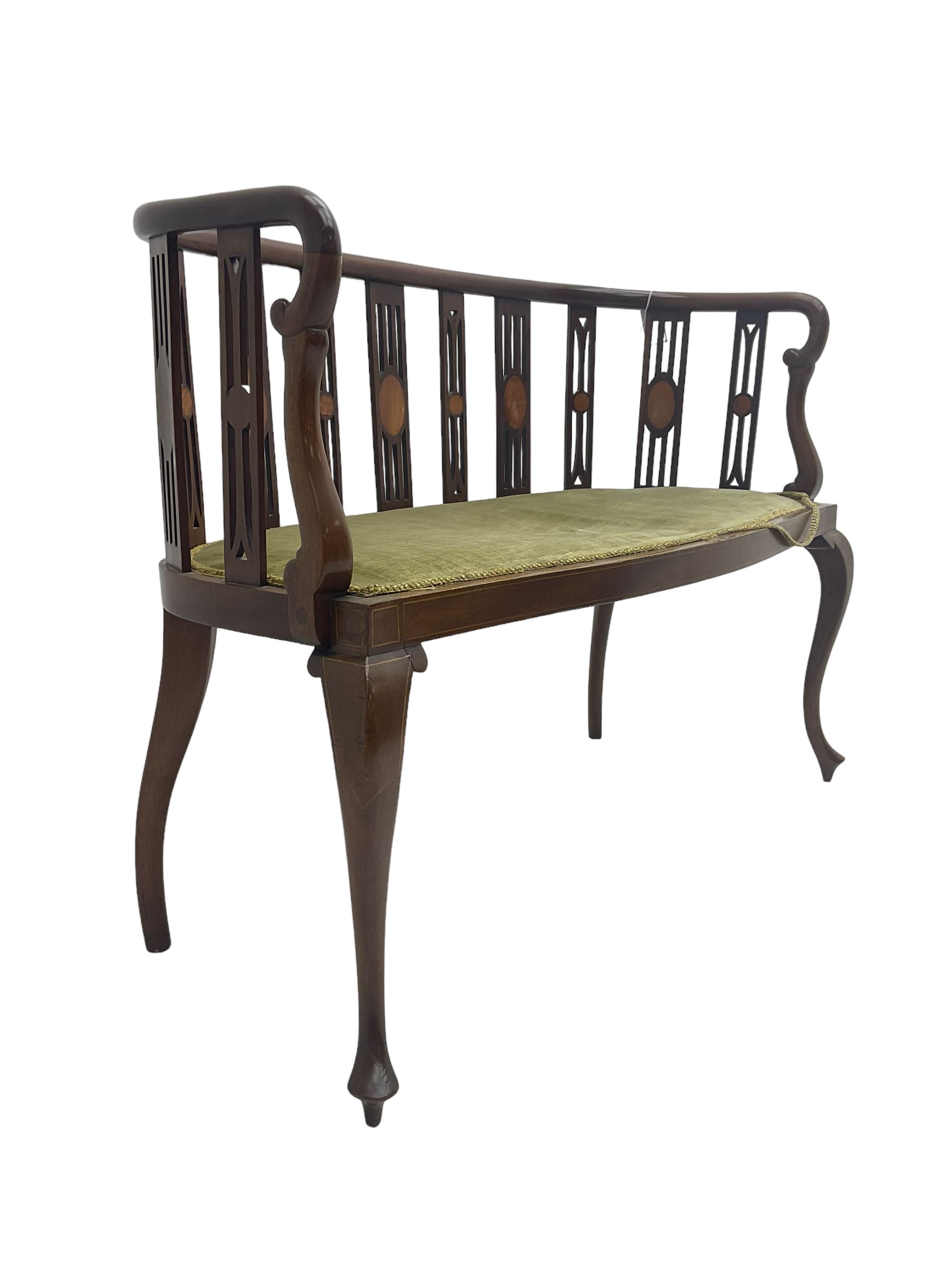 Edwardian inlaid mahogany salon settee or bench, the pierced and inlaid splat back over serpentine front, seat upholstered in laurel green velvet, raised on cabriole supports with satinwood stringing
