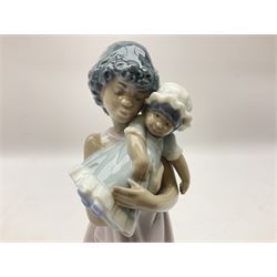 Three Lladro figures, comprising Sunday Best no 5758, Soft Meow no 5995 and Baby Doll no 5608, all with original boxes, largest example H31cm