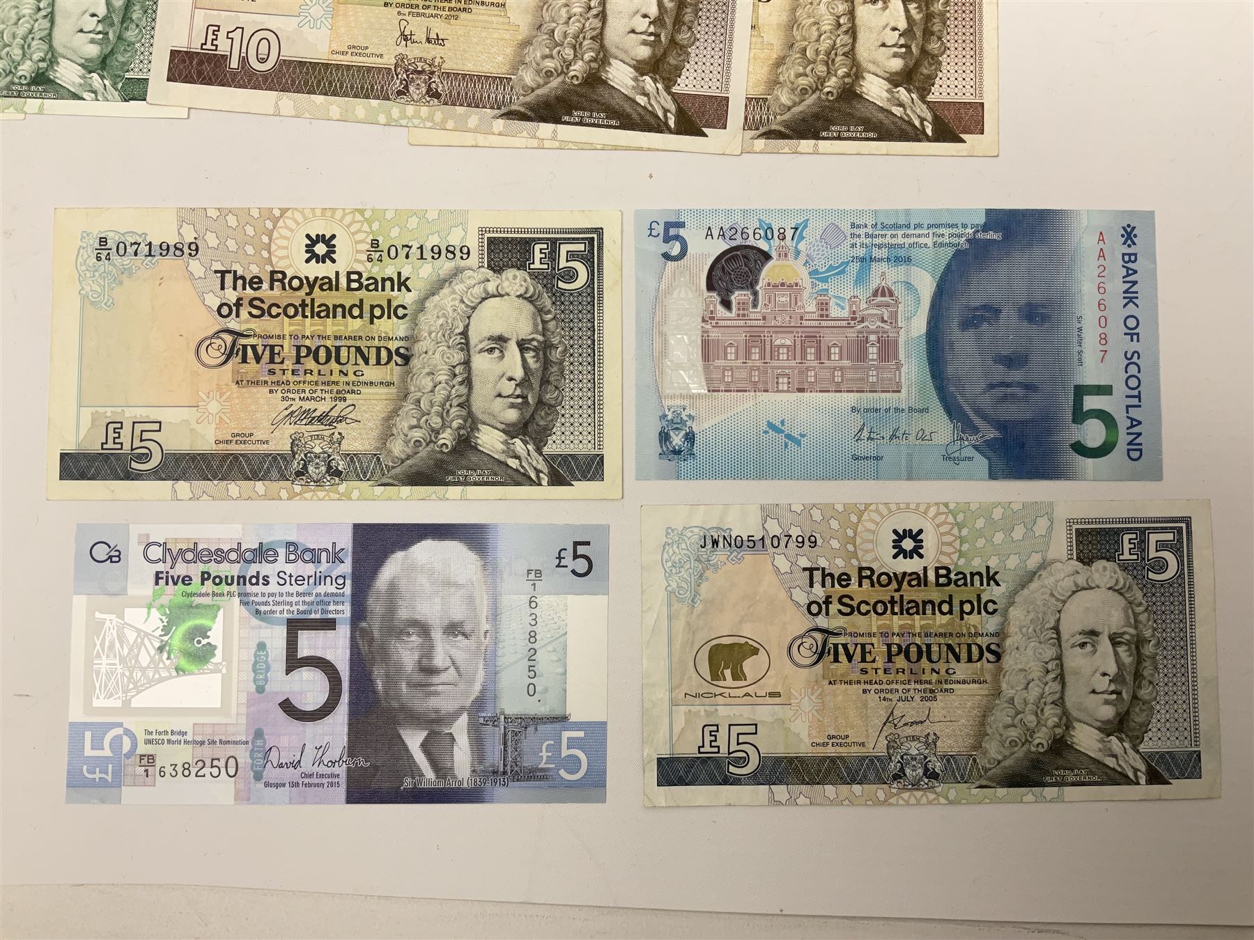 Irish and Scottish banknotes to include Bank of Ireland 5 January 1939 ‘B15’ one pound, two Bank of Scotland 1964 ‘AD07’ and ‘AF05’ one pound notes, one 1966 ‘CQ77’ one pound, and further notes from Clydesdale Bank, National Commercial Bank of Scotland Ltd. etc, housed in plastic sleeves