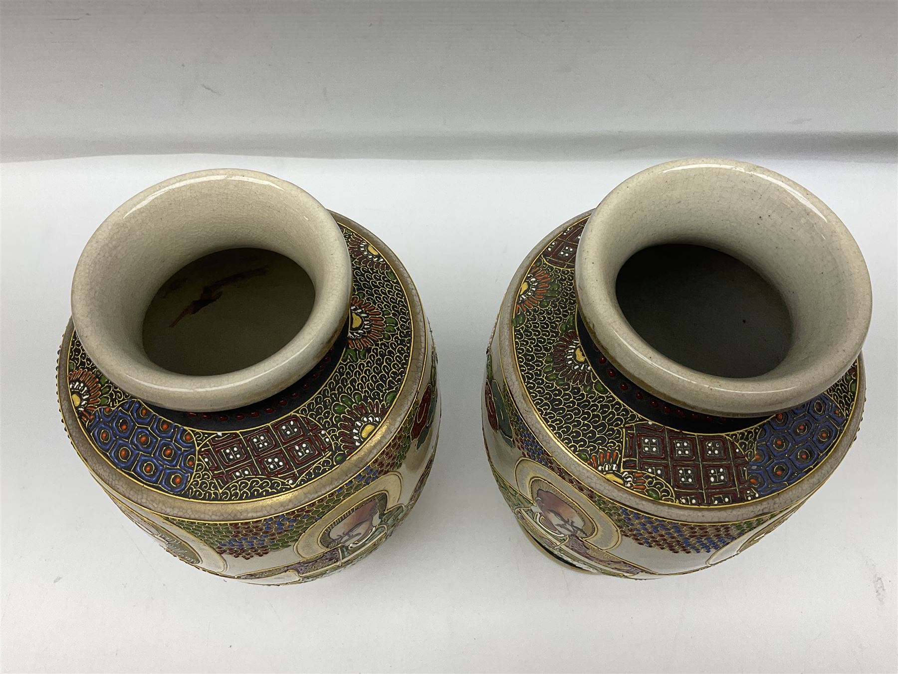Pair of early 20th century Japanese Satsuma vases, decorated with immortals, with painted mark to base, H26cm
