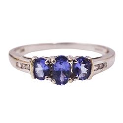 9ct gold three stone oval tanzanite ring, with channel set diamond shoulders, stamped 375