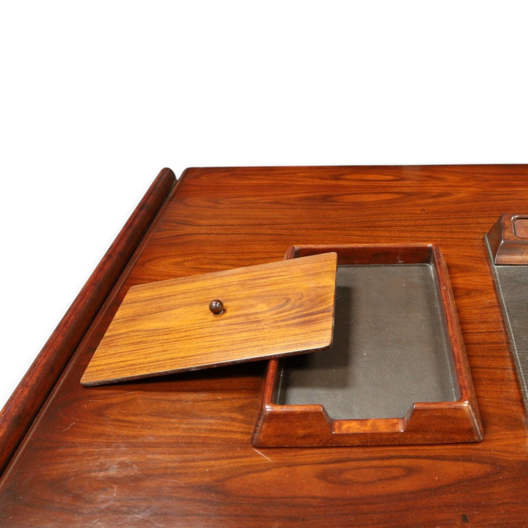 Dyrlund - Santos rosewood office suite, comprising an executive desk and cream leather upholstered swivel chair, the desk with a broad rectangular top with rounded corners, leather writing surface, pen compartments and letter tray, three lockable frieze drawers with fitted interiors above a central kneehole flanked by floating drawer pedestals, the left housing a filing drawer and the right three compartmented drawers, with a full width modesty panel to the reverse, chair raised on a castor base, H 116cm, W 62cm, D 74cm