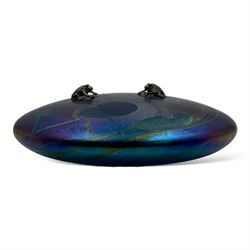 John Ditchfield for Glasform disc paperweight in iridescent purple with green lily trail and a pair of silver hallmarked frogs to top, D14cm