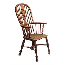  Early 19th century ash and elm high back Windsor armchair, shaped pierced splat and stick back, turned supports joined by crinoline stretcher, seat stamped 'J. Spencer'  