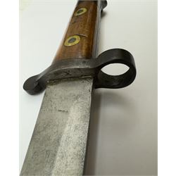 WWII Lee Metford rifle bayonet with original scabbard marked 586, with canvas frog, L44cm overall 
Notes; due to the condition of the bayonet it is possible this was issued to the home guard