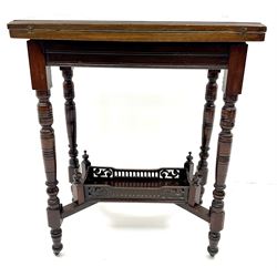 Late Victorian mahogany folding card table, moulded top, turned supports joined by an undertier 