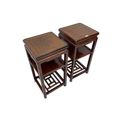 Pair Chinese lacquered hardwood stands, square moulded top above panelled undertier and constructed rail undertier, the frieze carved with scrolls, all united by square supports