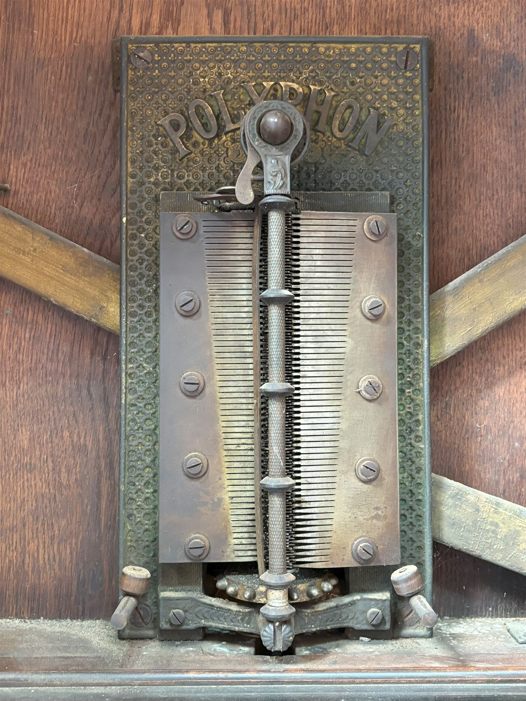 Victorian Penny-in-the-slot Polyphone, the walnut case with arched pediment and applied cartouche above pierced fretwork spandrels, glazed door above drawer to base, retailers label to each side reading 'H.Peters & Co. London Made in Leipzig' enclosing a fully working mechanism complete with 11 disks (50cm diameter) and winding handle.   - COLLECTION BY APPOINTMENT FROM: The White House, Thirsk Road, Easingwold, York, YO61 3NF - CALL 01723 507111 TO ARRANGE