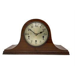 Sapele Mahogany cased tambour mantle clock c1950 with a three-train chiming movement, chiming the quarters on 5 gong rods, with a silvered dial, Arabic numerals, minute track and steel spade hands, strike/silent facility. With pendulum.



