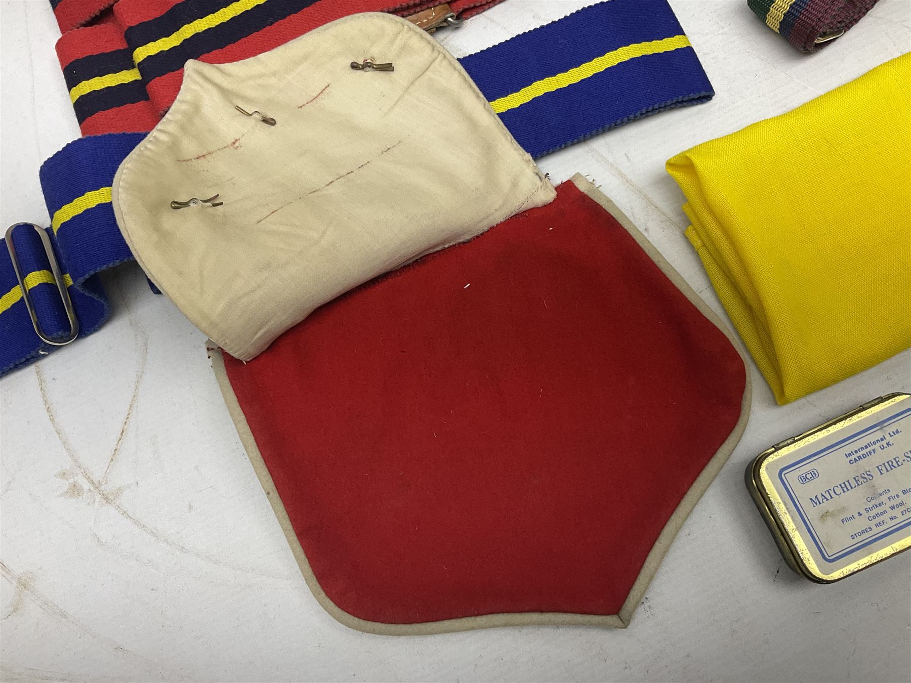 Miscellaneous militaria including two Royal Artillery and one Royal Horse Artillery stable belts; Northamptonshire Regiment trench art brass shell case lighter; unused Matchless Fire-Set; pocket knives and multi-tool; lanyards; oak shield with York & Lancaster crest etc