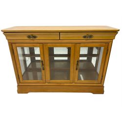 Yew wood sideboard, rectangular top with mahogany and ebony stringing, fitted with two drawers over three glazed cupboard doors enclosing glass shelves