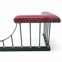 Wrought metal and brass fire fender, L-shaped corner seats upholstered in burgundy fabric with stud bands, dished centre on balustrade and plain curb  