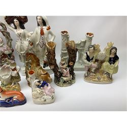 Collection of Victorian Staffordshire and Staffordshire style pottery, to include Prince of Wales on horseback, pair of lovers on a spill vase, pair of greyhound penholders, pocket watch holder modeled as a castle, etc.  