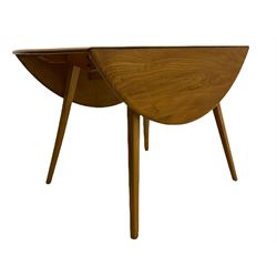 Ercol light elm oval drop leaf table, on splayed tapering suppports