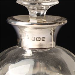 Silver upright photograph frame, aperture size 14cm x 9.5cm Birmingham 1919, pair of glass scent flasks with silver collars H16cm , two others, two dressing table jars with silver covers and a silver candlesticks