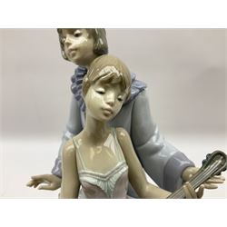 Lladro figure, Minstrel's Love, modelled as a couple entertaining, the lady in ballerina costume playing the lute and the gent stood behind her in jester type dress, sculpted by Rafael Lozano, with original box, no 5821, year issued 1991, year retired 1993, H31cm