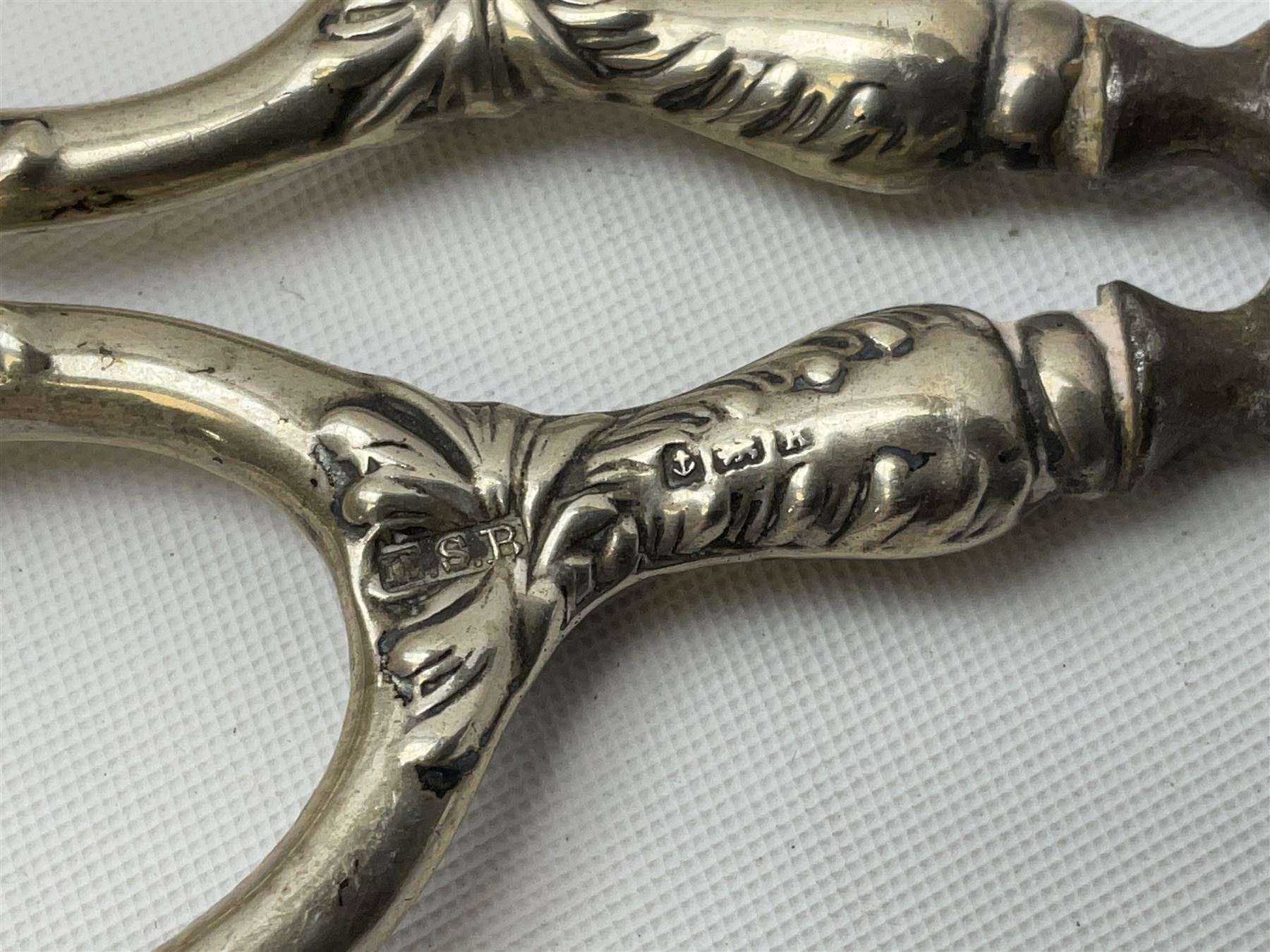 Small group of silver, to include Georgian Fiddle pattern teaspoon, later teaspoon, sugar tongs, etc., all hallmarked, approximate weighable silver 59 grams, approximate gross weight 113 grams