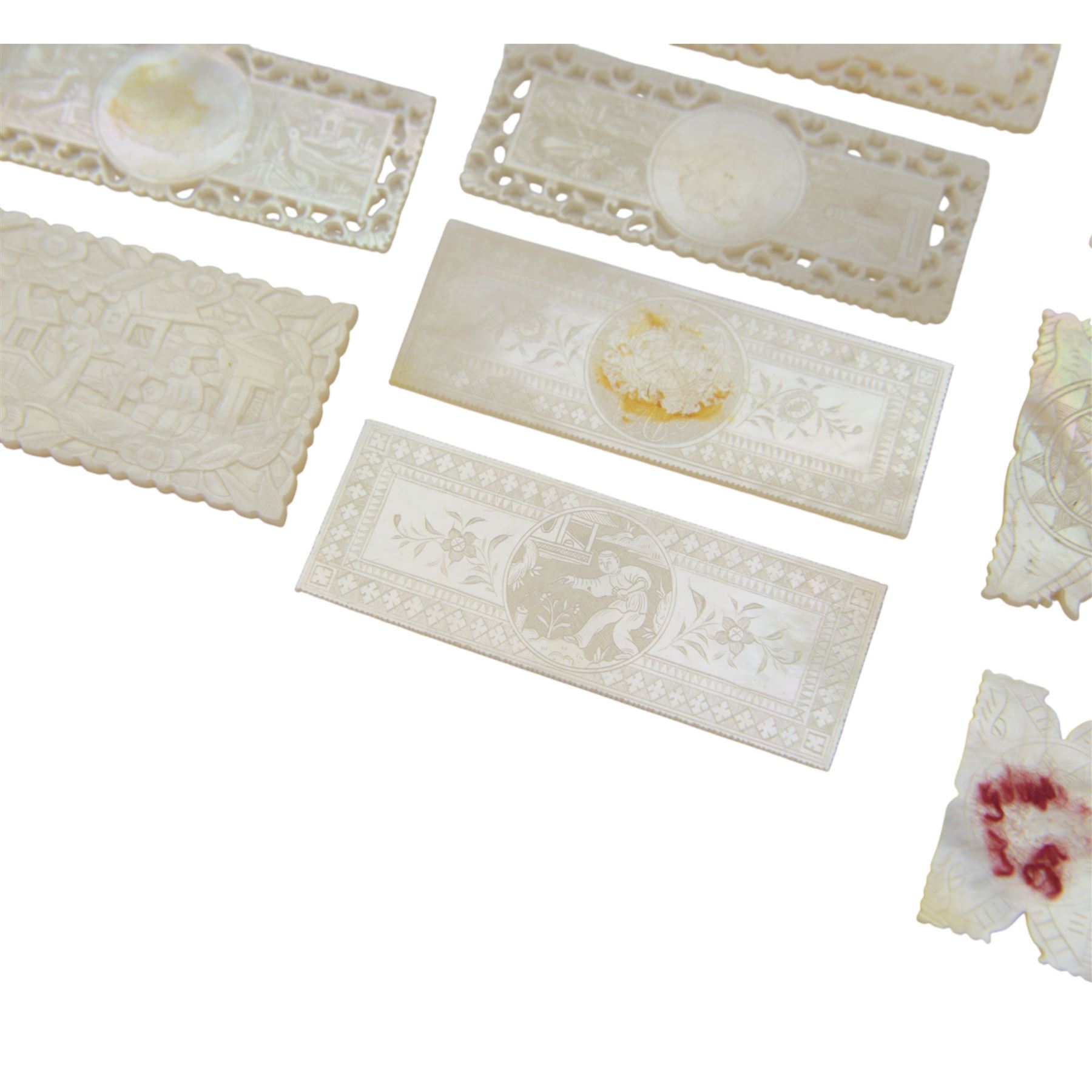 Chinese mother of pearl gaming tokens, of varying shape and design, including carved and engraved examples