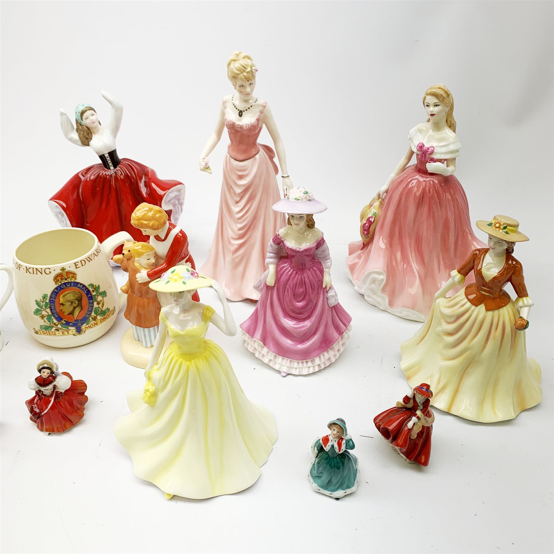 A collection of figurines, to include a selection of Royal Doulton