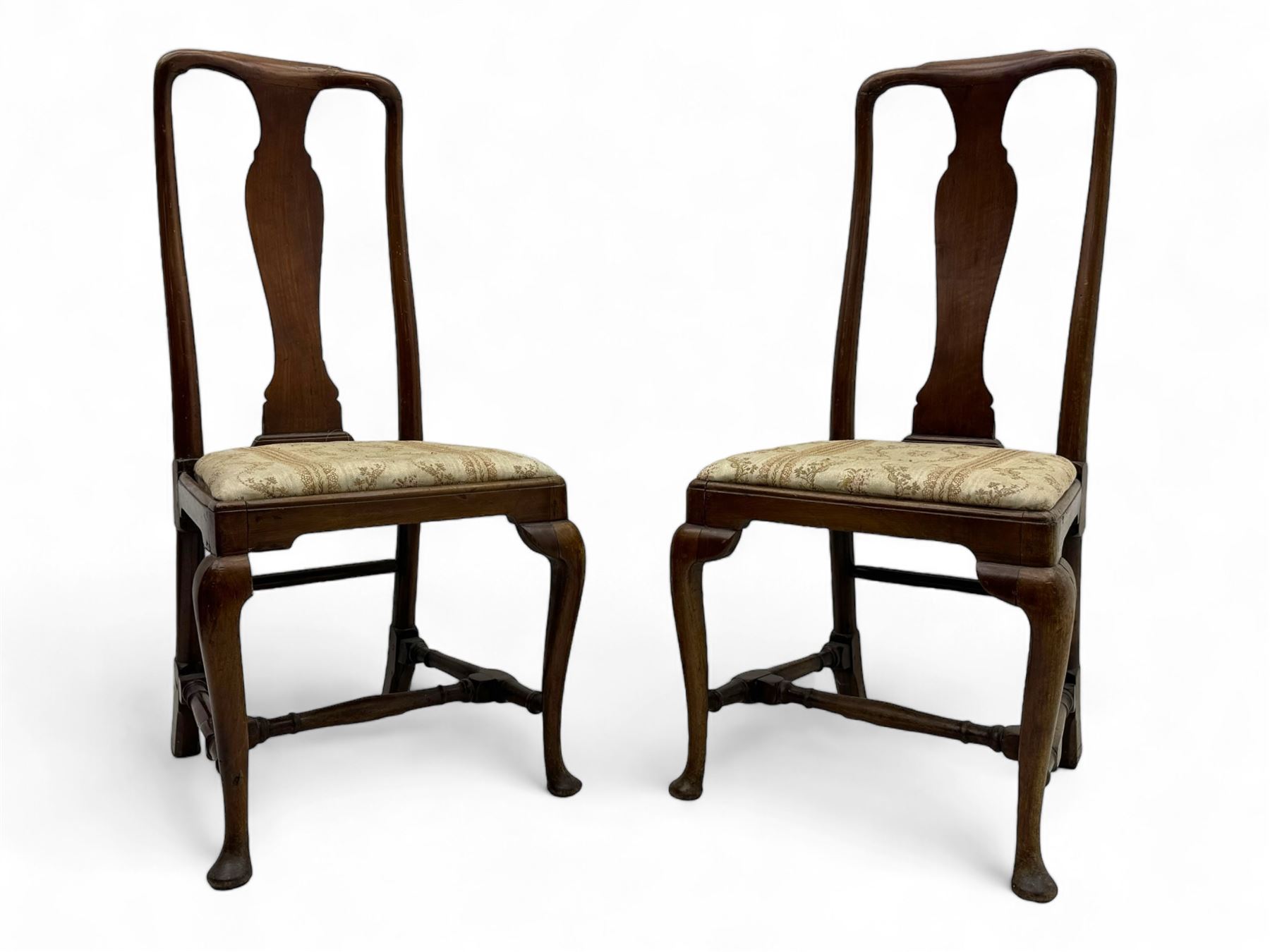 Pair of 19th century Queen Anne design walnut framed side chairs, yoke crest rail over vase-shaped splat, upholstered drop-in seats, raised on cabriole supports with pad feet united by turned stretchers