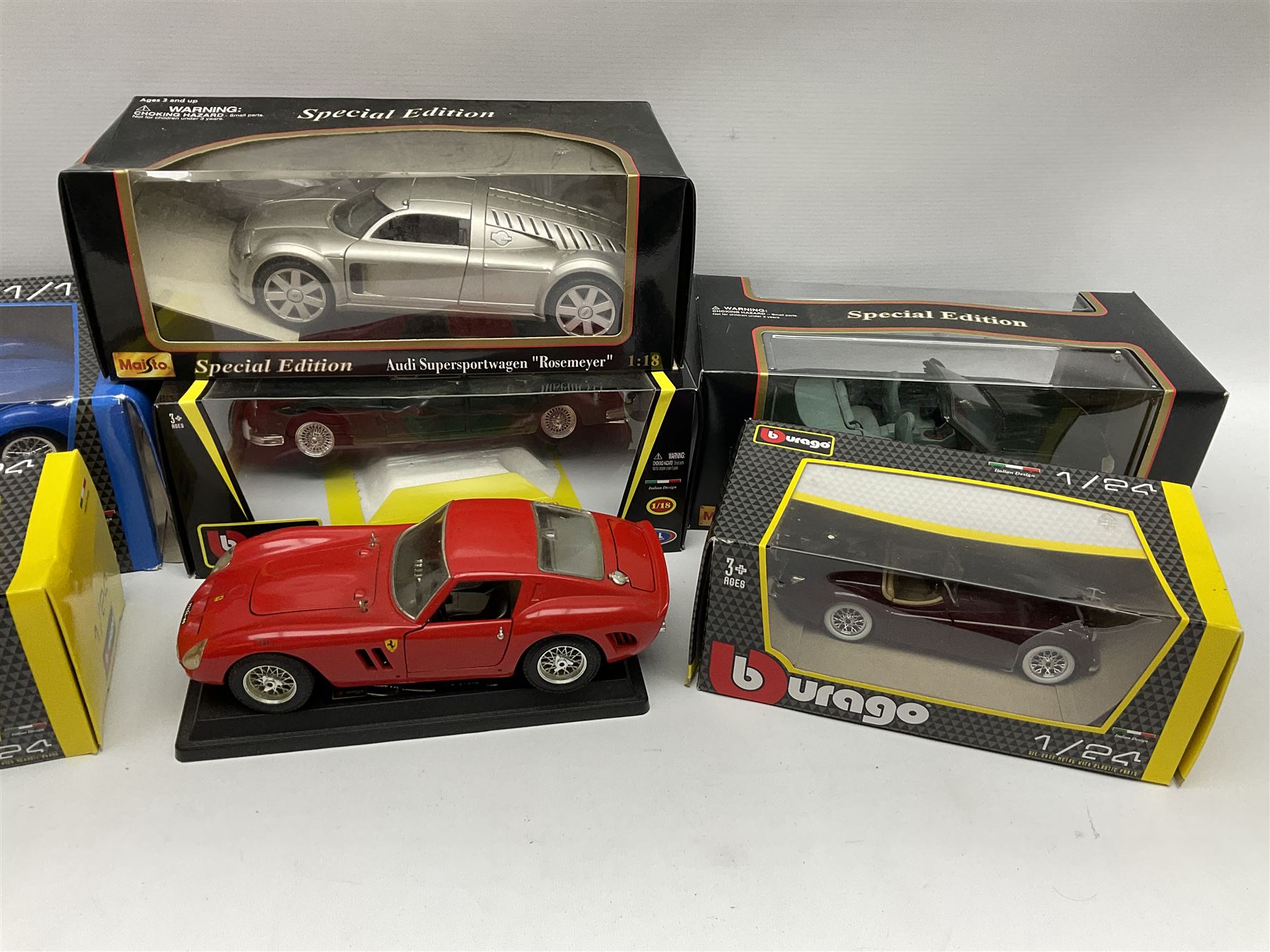 Two Maisto 1:18 scale die-cast models of Jaguar XK8 and Audi Supersportwagen 'Rosemeyer'; both boxed; two Bburago 1:24 scale models and two 1:18 scale of a Jaguar Mark II and Bugatti Type 59; all boxed; and Bburago 1:18 scale Ferrari GTO; unboxed (7) 