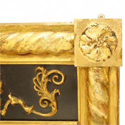 19th-century Regency-style ebonized and giltwood pier mirror, rectangular form frame with twisted rope columns on either side, ebonized frieze panel decorated with gilt applique scrollwork and central anthemion and arabesques