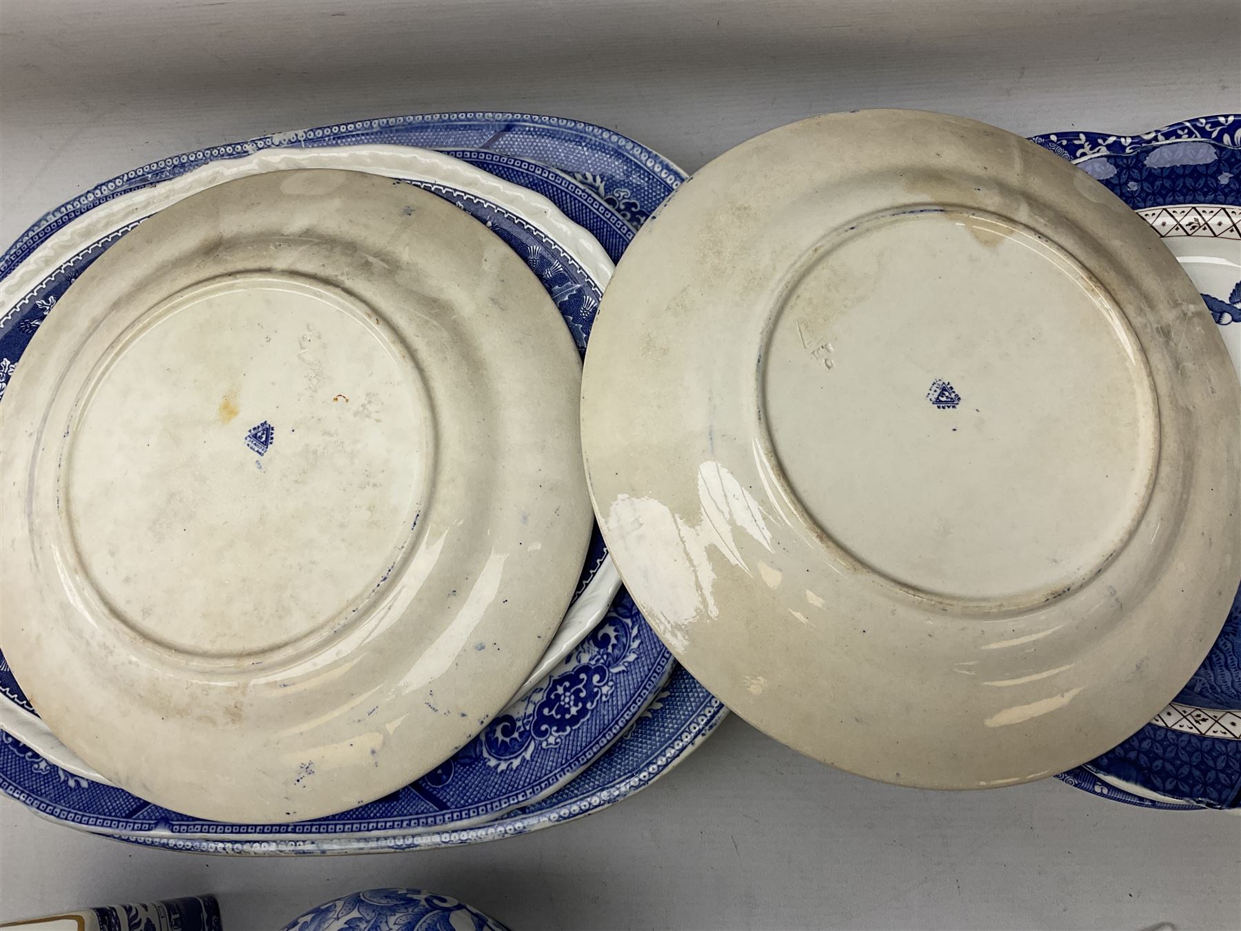 Quantity of blue and white ceramics to include Spode Italian pattern shallow bowl, Booths plate decorated with willow pattern, Wedgwood Jasperware tulip vase, T.G Green Cornish ware lidded storage jar, Delft style ceramics etc in two boxes