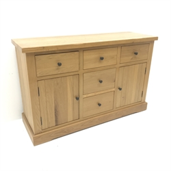 Light oak sideboard, five drawers, two cupboards, plinth base, W143cm, H91cm, D48cm