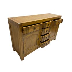 Oak sideboard, fitted with six drawers and two cupboards
