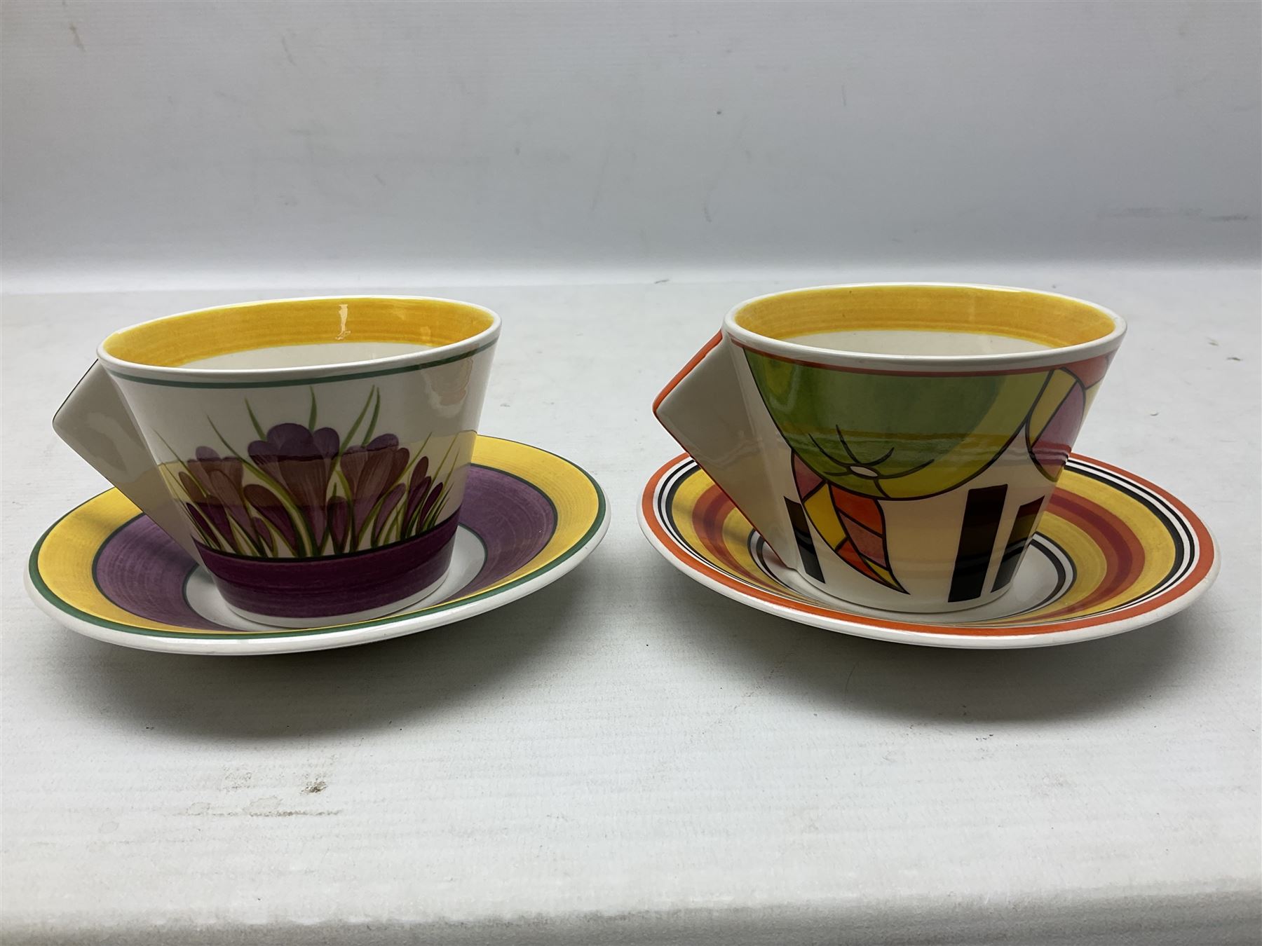 Wedgwood limited edition Clarice Cliff Design Taking Tea collection, comprising eight cups and saucers Honolulu, Apples, Gibraltar, Lilac Crocus, Trees and House, Coral Firs, Devon, and Sunray, with certificates of authenticity 