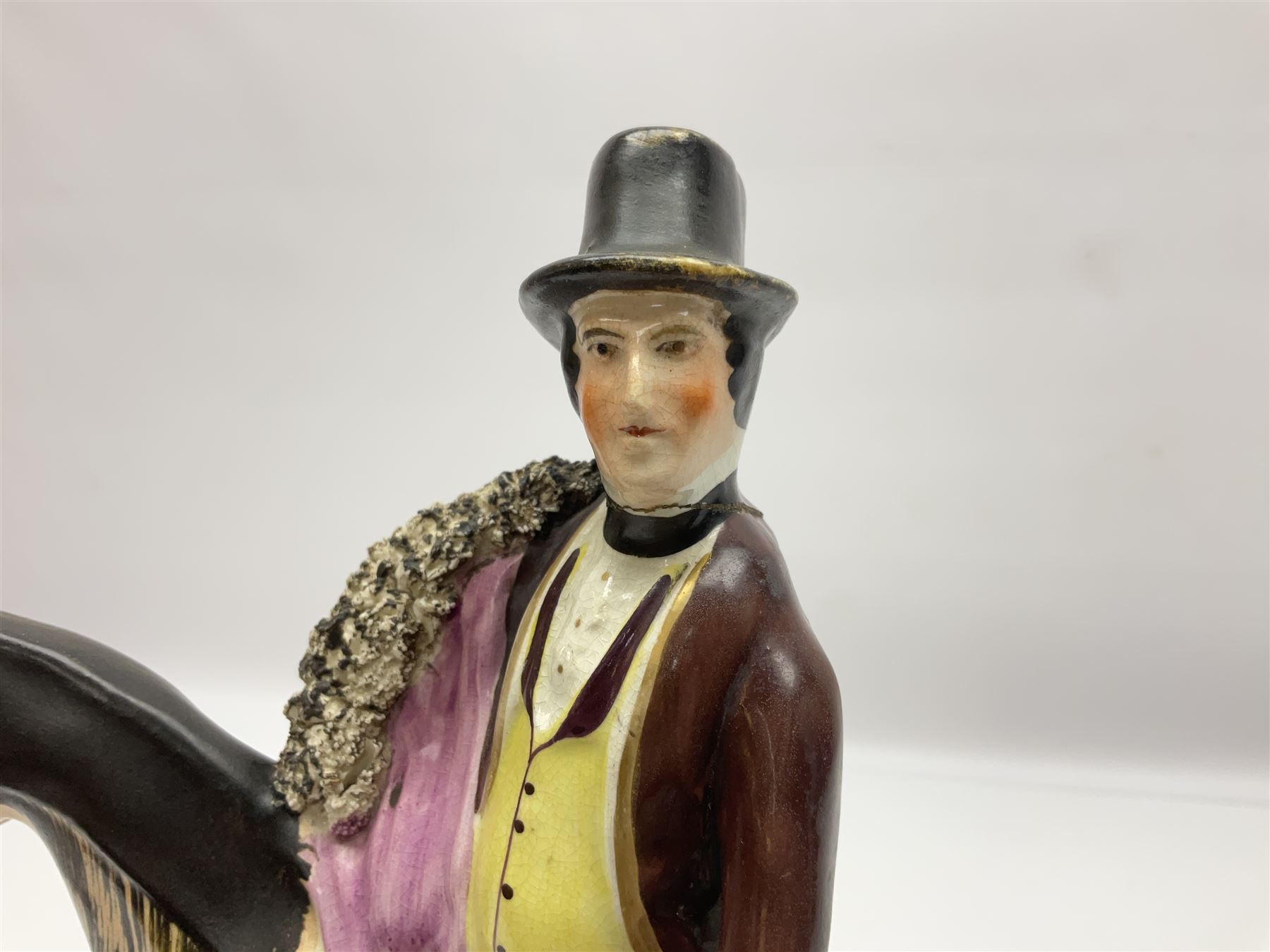 19th century Staffordshire figure of Robert Peel, titled 'Sir Robert Peel', modelled on horseback, atop an oval plinth base featuring a naturalistic and floral design, H30cm 