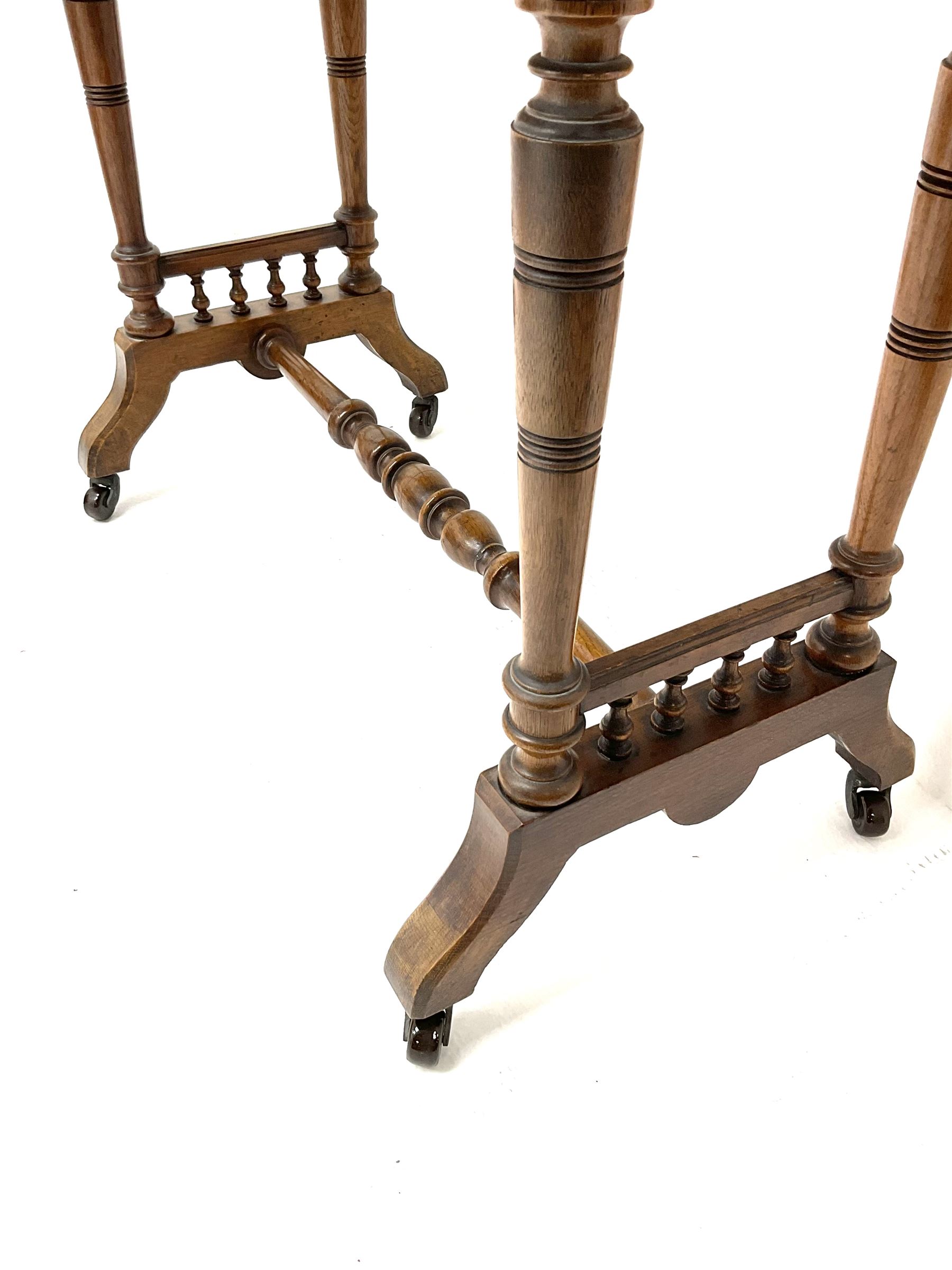 Late Victorian oak side table, moulded top, bobbin turned supports and stretcher, shaped feet and castors