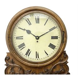 Winterhalter and Hoffmeier -  German oak cased early 20th century fusee wall clock, with a circular wooden surround and a spun brass glazed bezel to the dial, housed on an integral carved bracket with shaped corbel supports, painted dial with Roman numerals, minute track and steel spade hands, dial pinned directly to a four pillar chain driven fusee movement with a recoil anchor escapement. With pendulum and key. 
German fusee movements by Winterhalter and Hoffmeier are comparatively rare, especially housed in carved wall clocks of this description. 