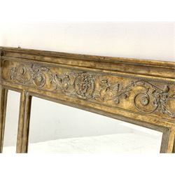 Regency style gilt wall mirror, scrolled foliate and mask decorated frieze over three sectional mirror glazed with bevelled glass, 140cm x 75cm