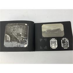 144 Squadron RAF - album containing over one hundred photographs and postcards of varying sizes including group shots, aircraft on the ground and in the air, German aircraft, crashes etc; sizes from 3.5 x 6cm to 16 x 21cm; and quantity of modern reference material

