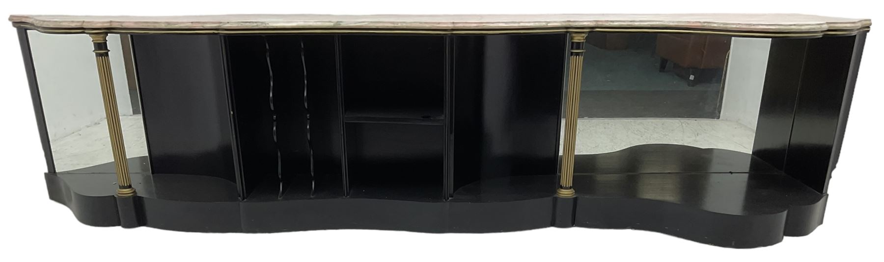 Italian ebonised and gilt serpentine corner console bookcase cabinet, shaped pink marble top over assorted shelves and dividers with fluted pilasters and mirror backs, on skirted base 