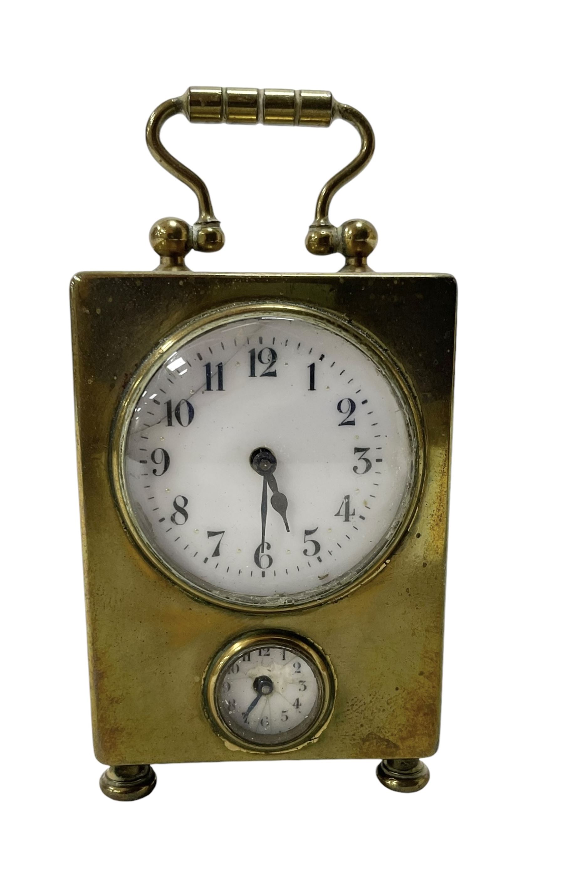 French - petite early 20th century French brass cased travelling alarm clock, with bun feet and carrying handle, circular enamel dial with Arabic numerals and spade hands, conforming alarm setting dial beneath, with a platform escapement, wound and set from the rear.